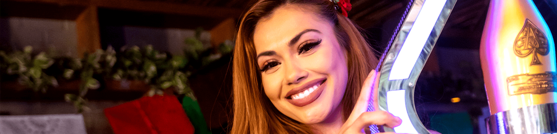 girl smiling and holding a bottle