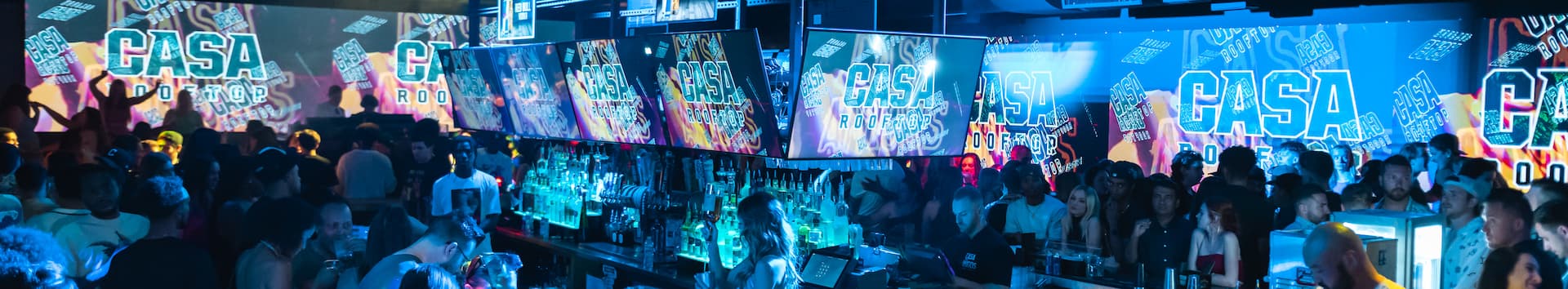 crowd around bar in nightlife ambience in Casa Amigos