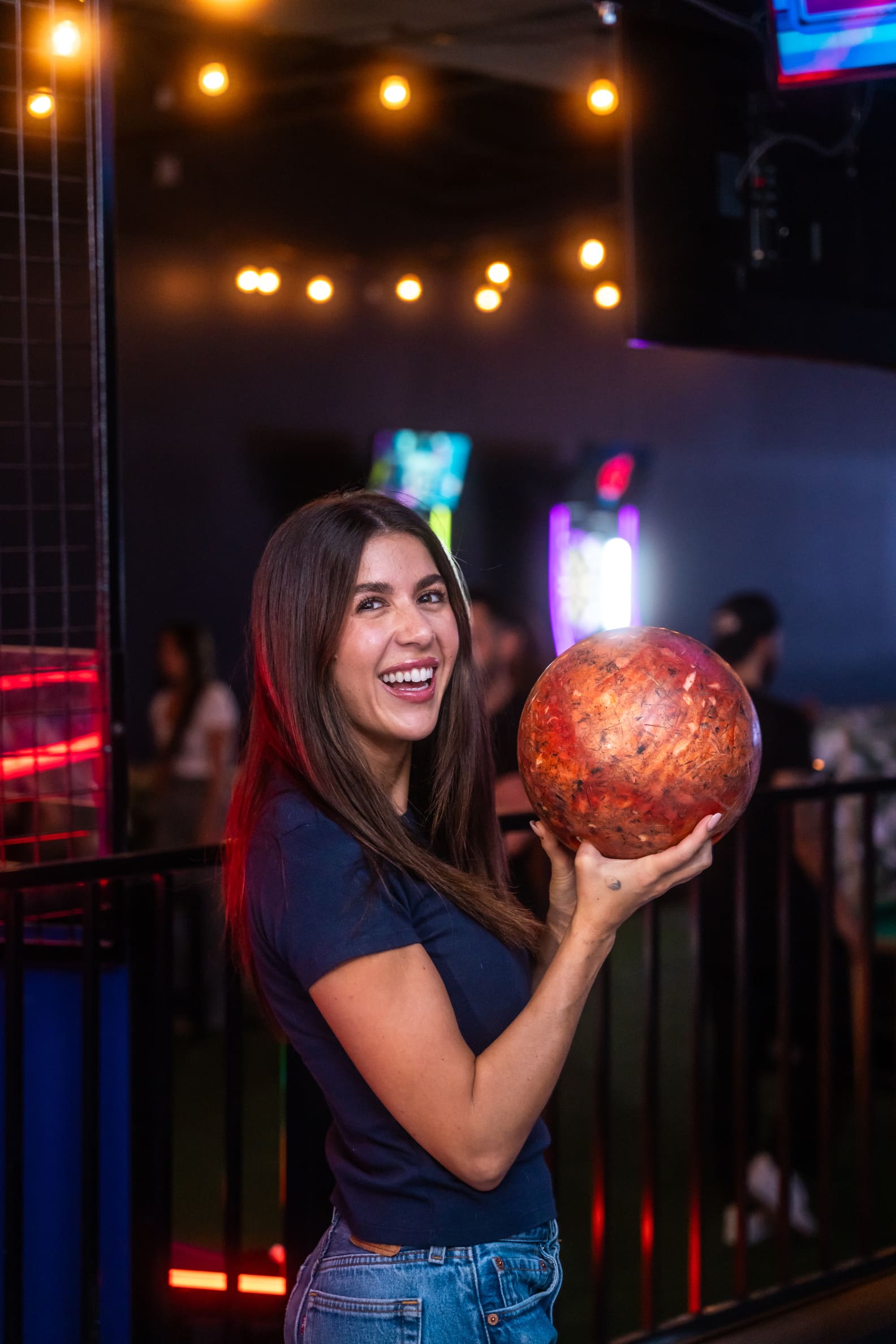 woman holding a bowling ball in Casa Amigos