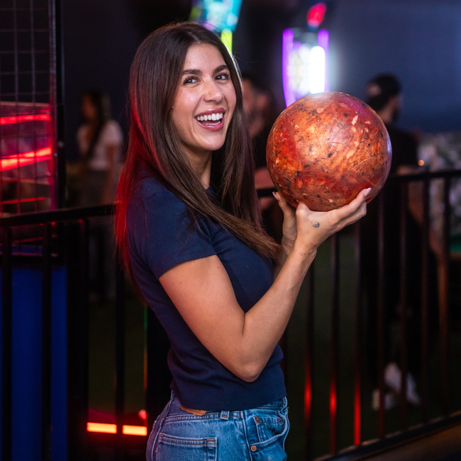 woman holding a bowling ball in Casa Amigos