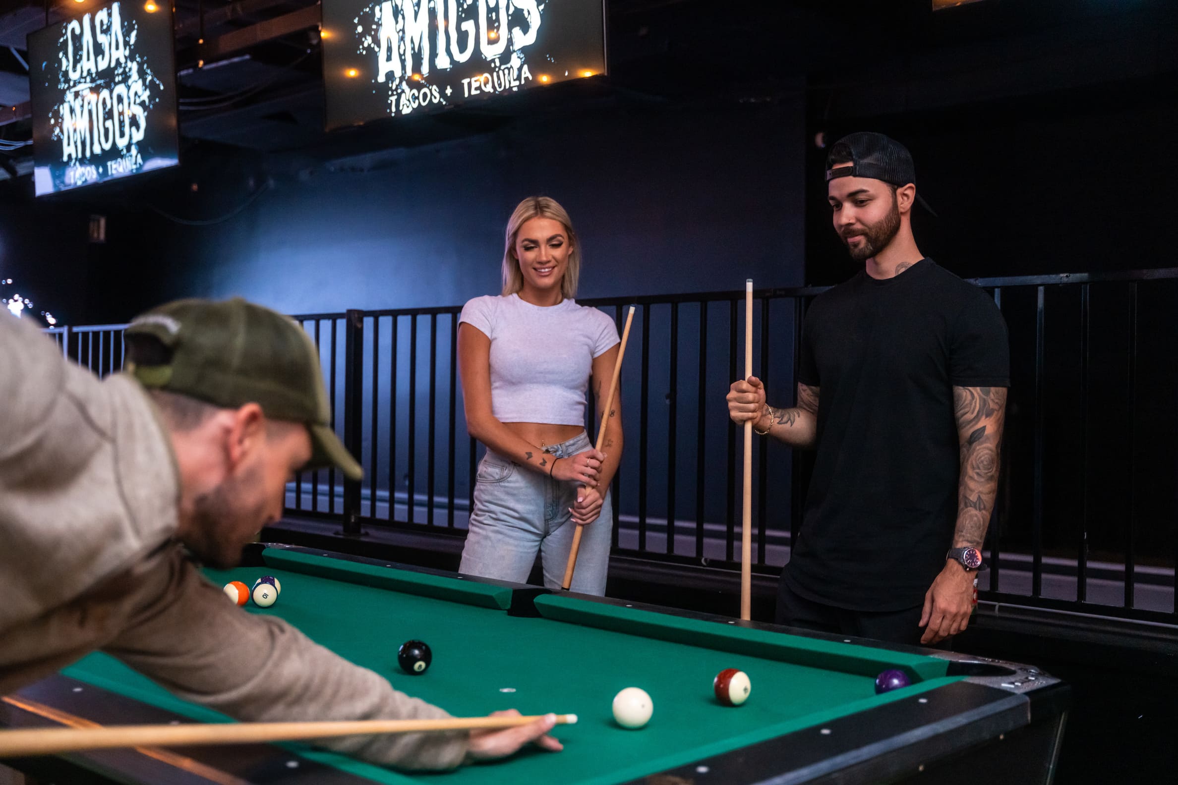 friends playing pool in Casa Amigos